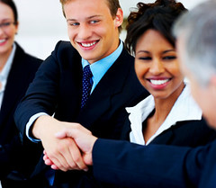 Colleagues shaking hands in an office